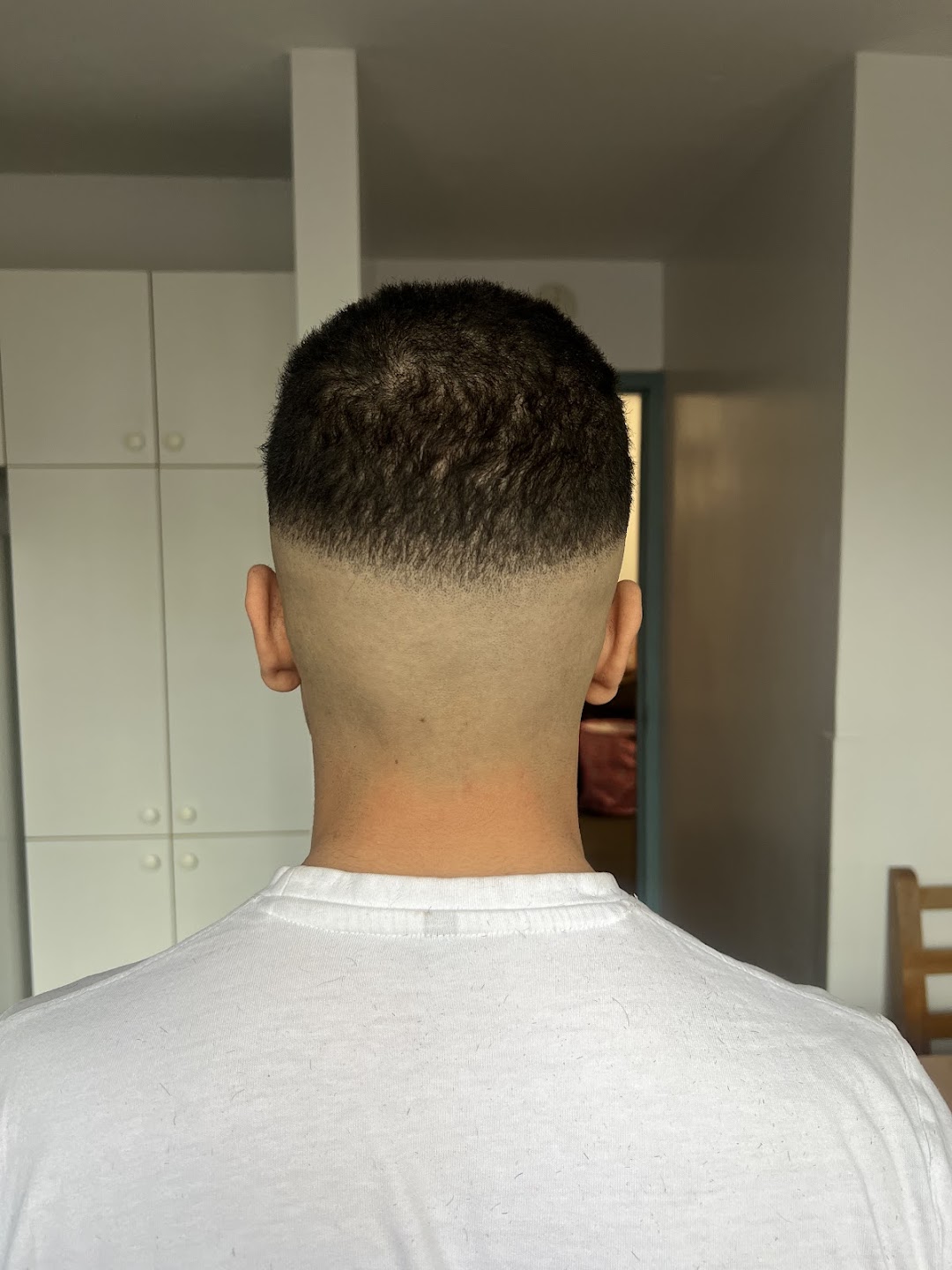 Clean fade haircut, back view